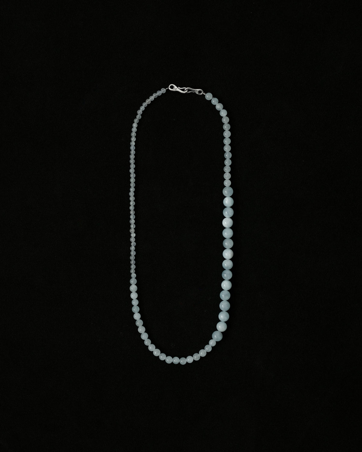 Natural aquamarine necklace on a black background