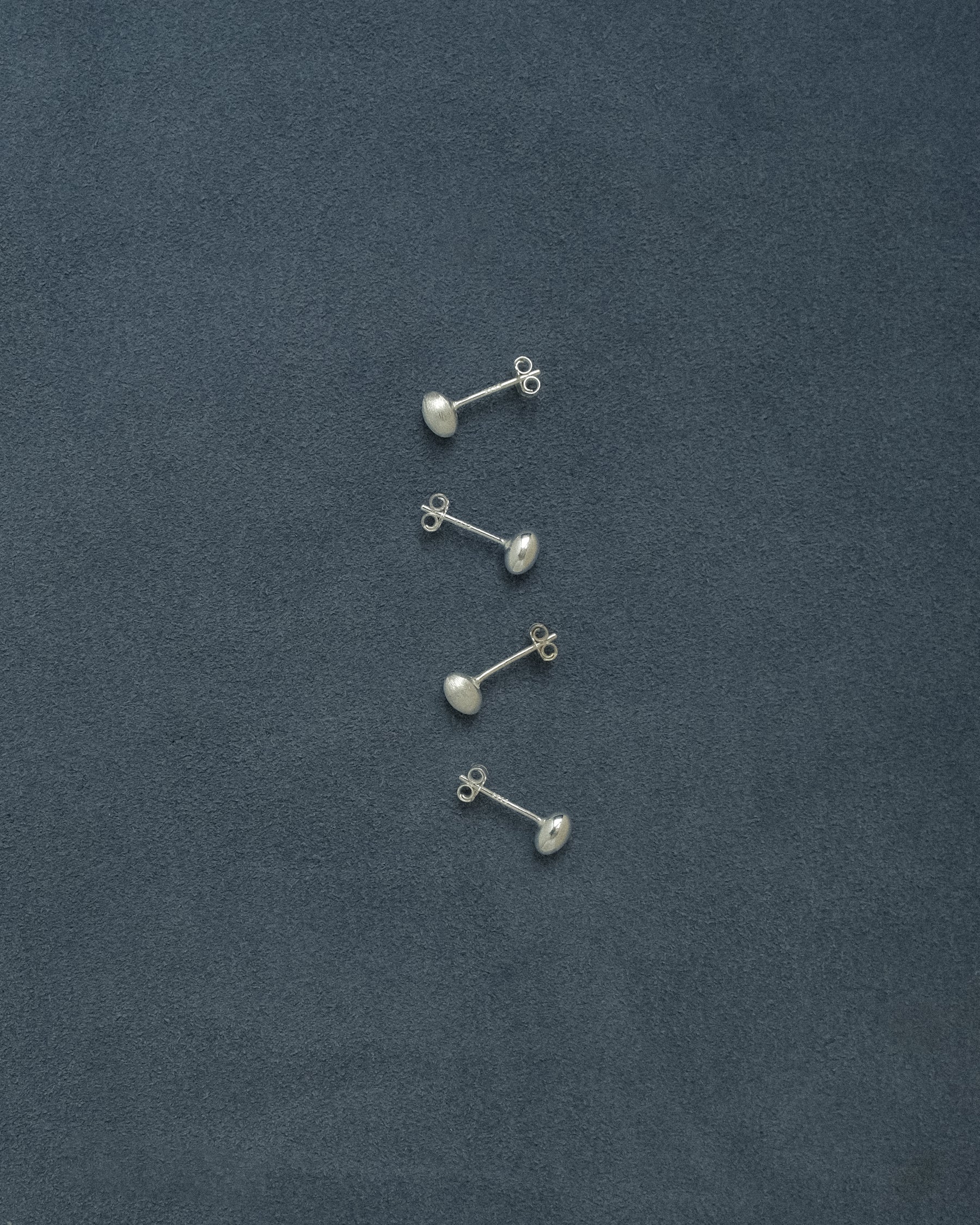 Ane Tiny Semibreve Stud Earrings