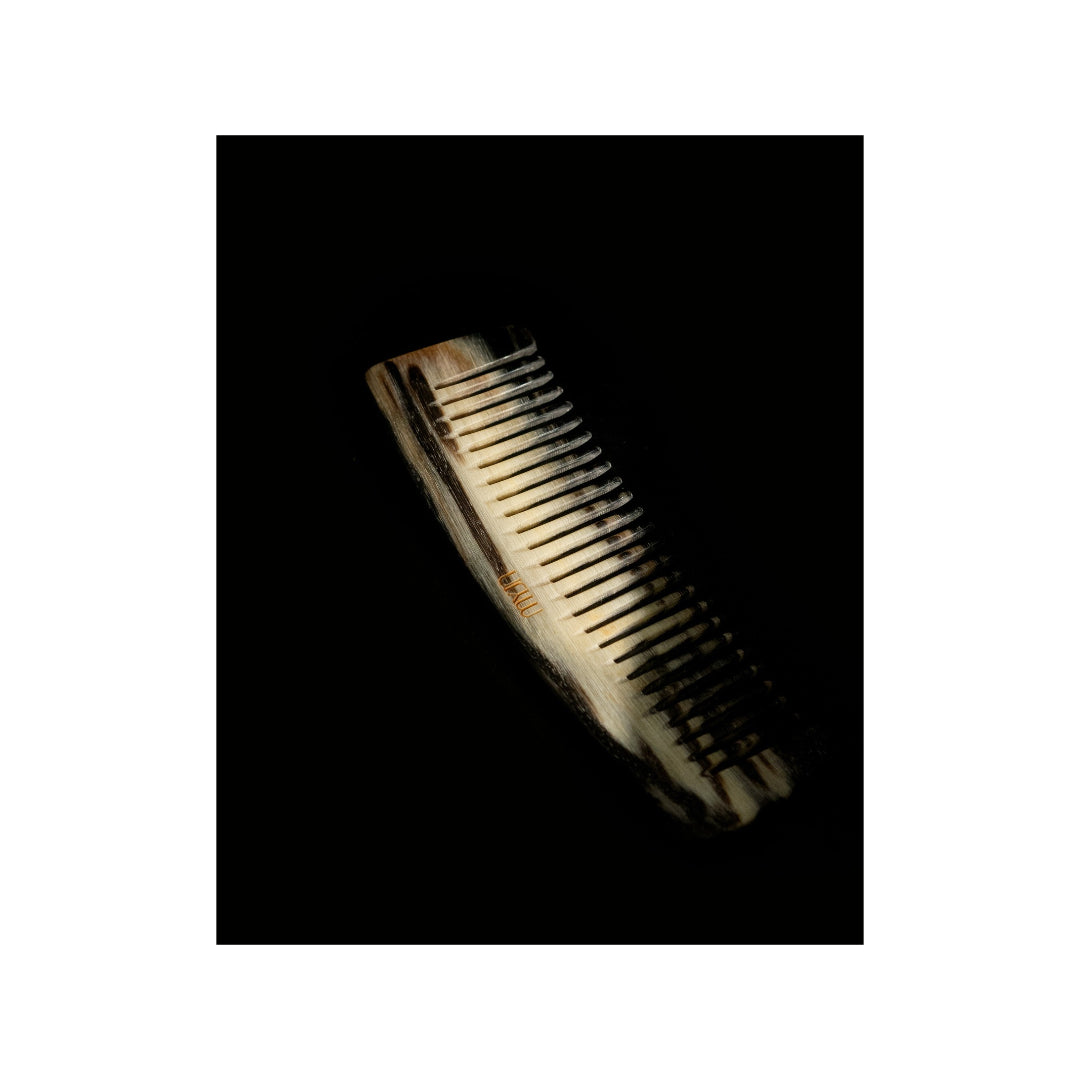 MYJN horn comb on a dresser, designed and polished by MYJN