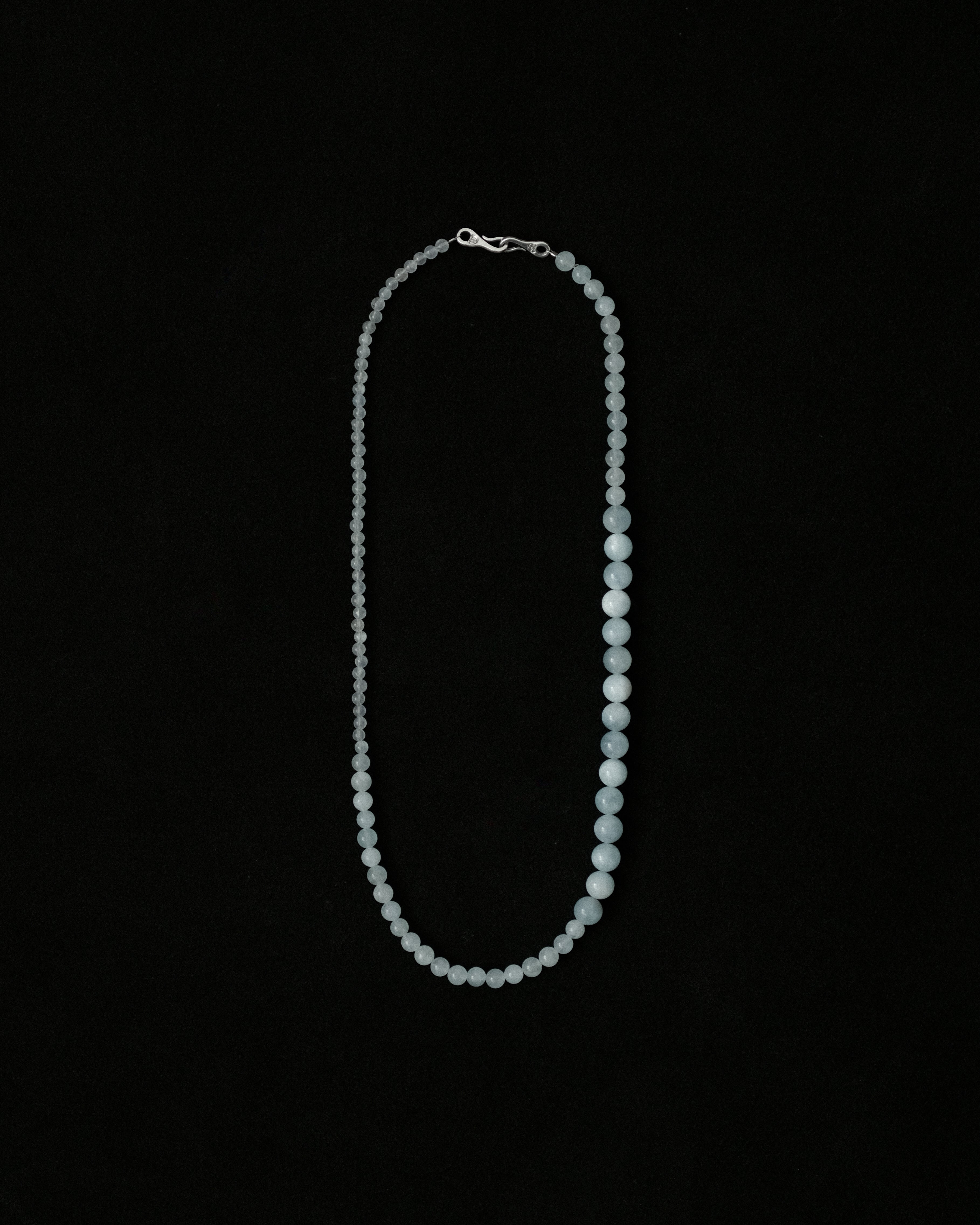 Natural aquamarine necklace on a black background